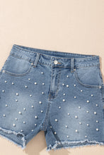 Load image into Gallery viewer, Dusk Blue Pearl Beaded Raw Hem Medium Wash Denim Shorts
